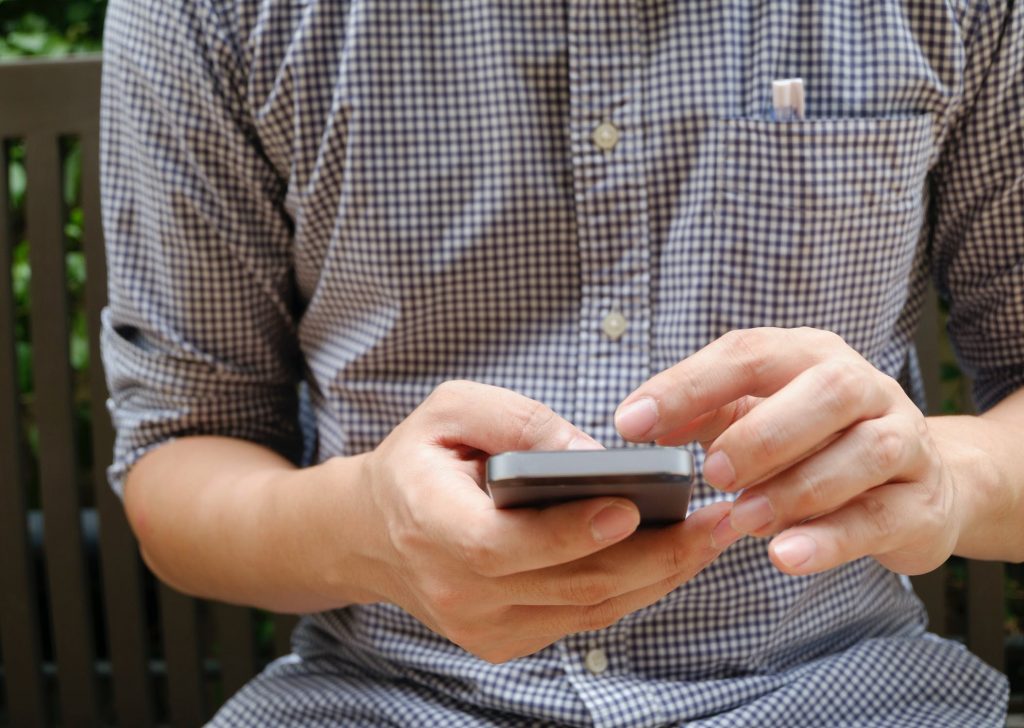 a guy using his mobile phone